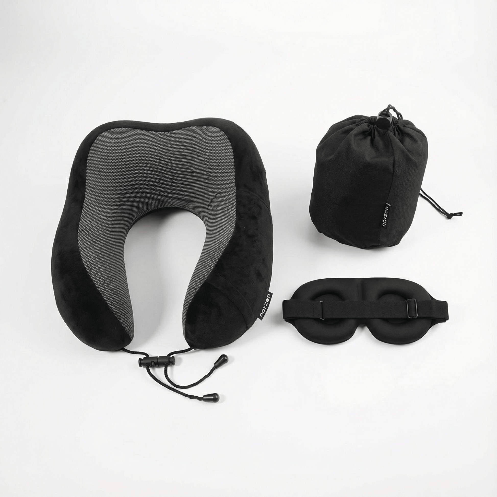 Sort NORZEN reisesett bestående av ergonomisk nakkepute, sovemaske og oppbevaringspose for komfortabel søvn på reise